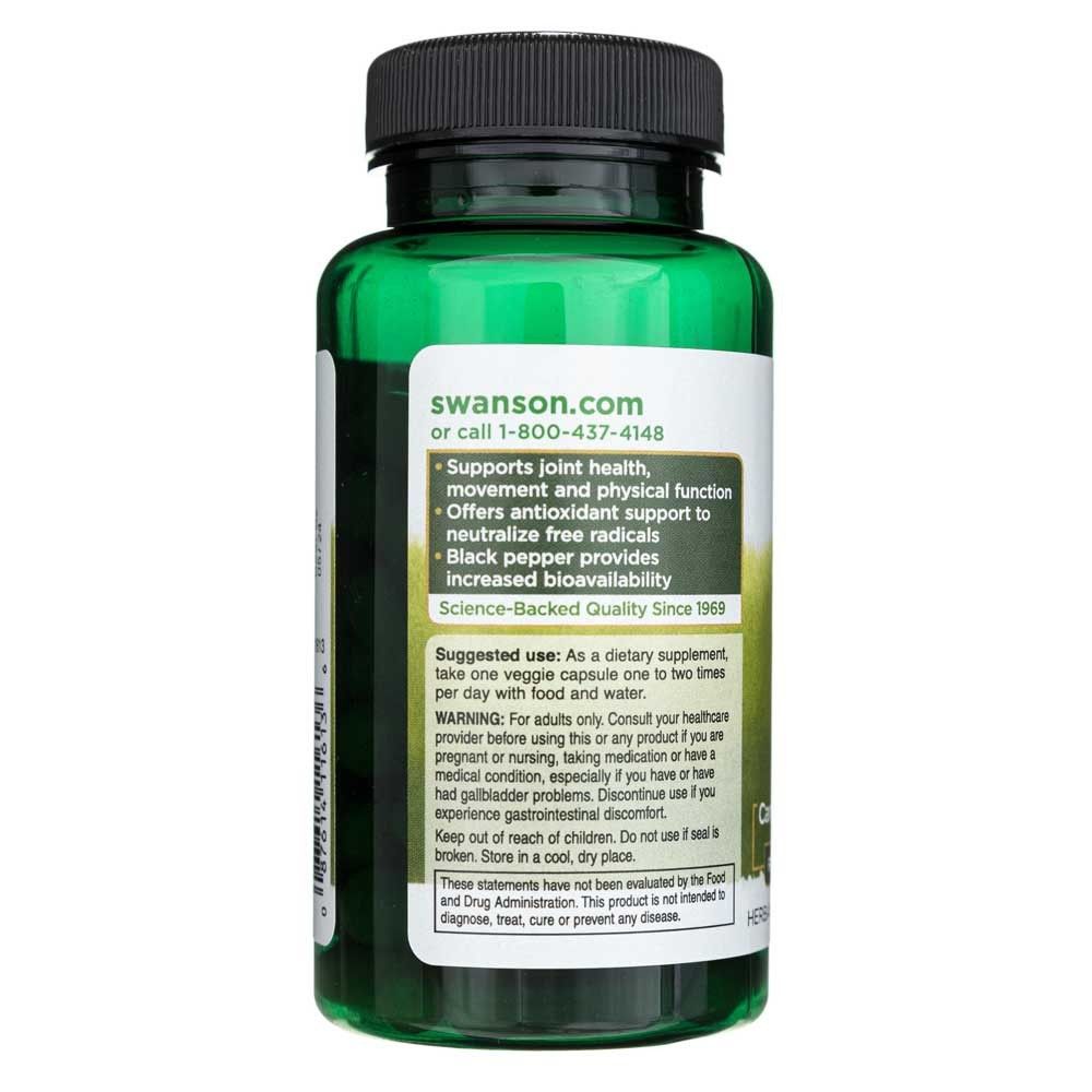 Retro di un flacone verde di curcuma e pepe nero Swanson. Mostra istruzioni per l'uso e avvertenze.