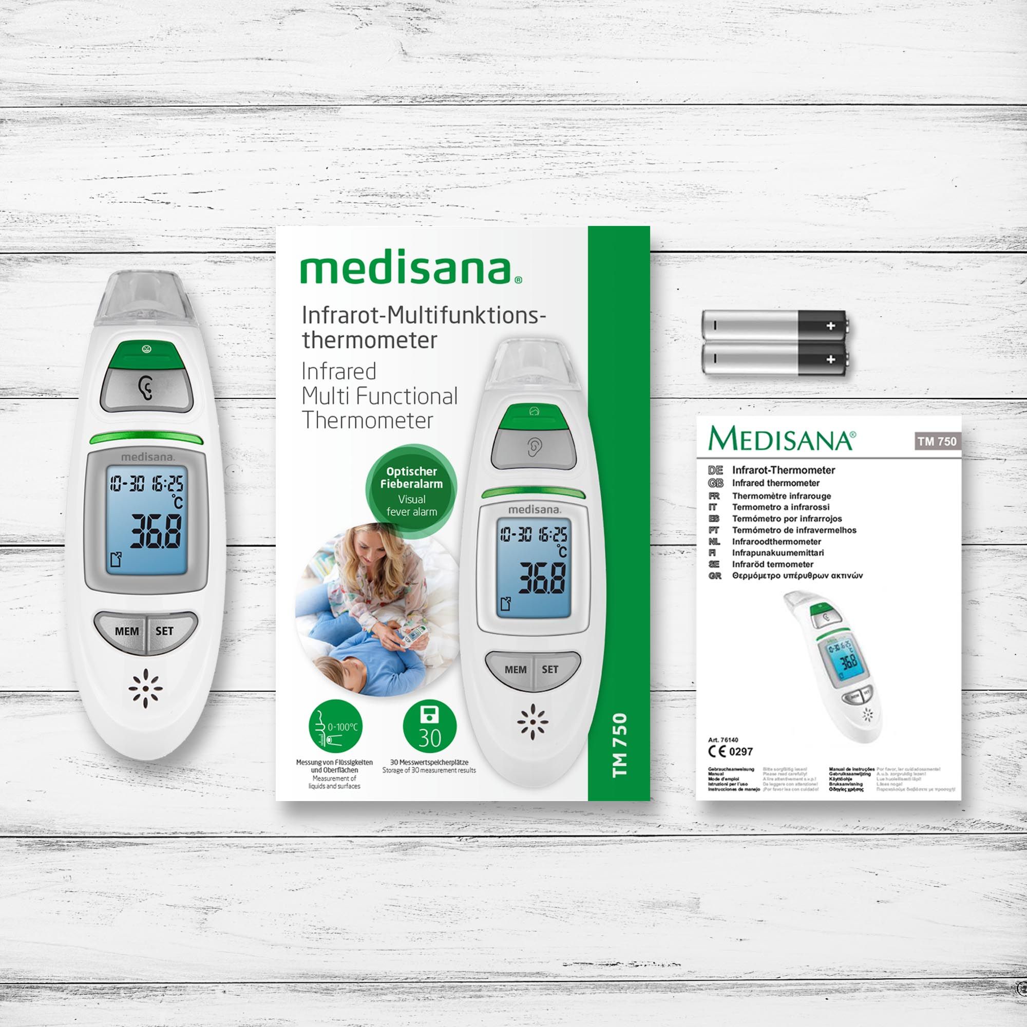 Confezione con termometro senza contatto, batterie e manuale. Marca: medisana.