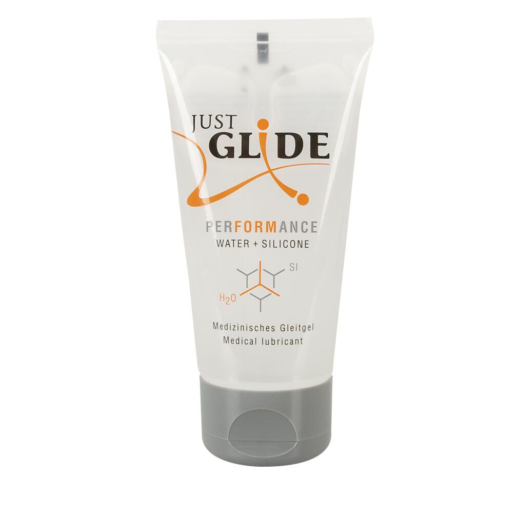 Tubo trasparente con tappo grigio. Scritta: JUST GLIDE PERFORMANCE WATER + SILICONE. Testo: Lubrificante medico.