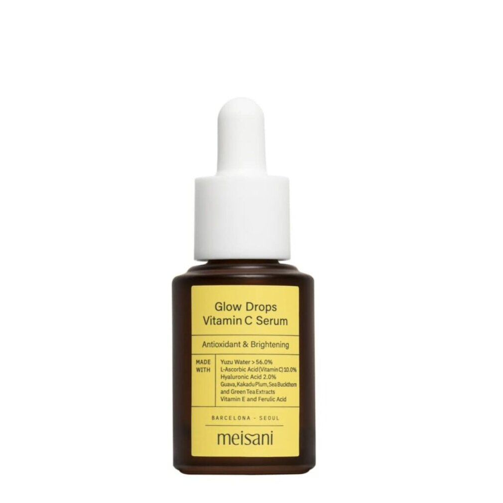 Flacone marrone con tappo bianco e pipetta. Etichetta gialla con testo: Glow Drops Vitamin C Serum. Marchio: meisani.
