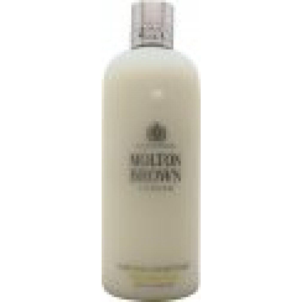 Flacone color crema con tappo argentato. Logo Molton Brown e testo. Scritta: Purifying Conditioner. Prodotto in Inghilterra.