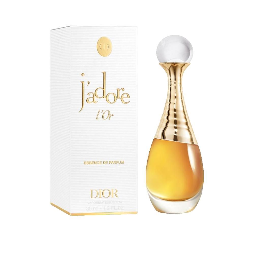 Flacone di profumo e confezione. Flacone dorato, a forma di goccia, con tappo. Confezione bianca con scritta dorata: J'adore l'Or, Dior.