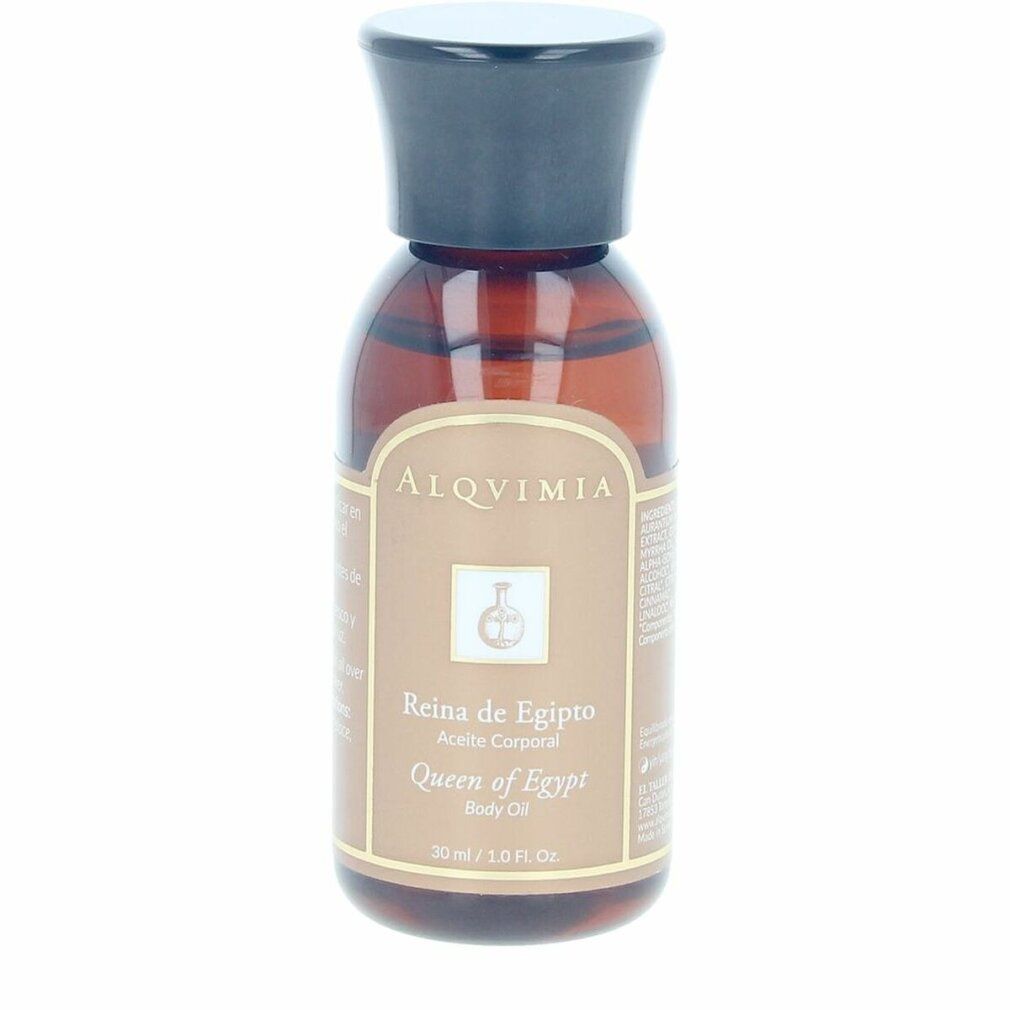 Flacone di olio per il corpo con tappo nero. Etichetta con nome del prodotto e logo. Etichetta dorata con testo.