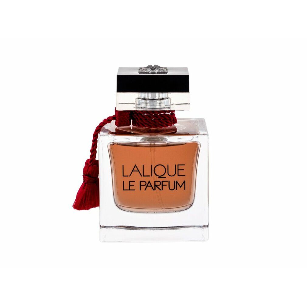 Flacone quadrato in vetro con liquido ambrato. Tappo nero, nappa rossa. Scritta: LALIQUE LE PARFUM.