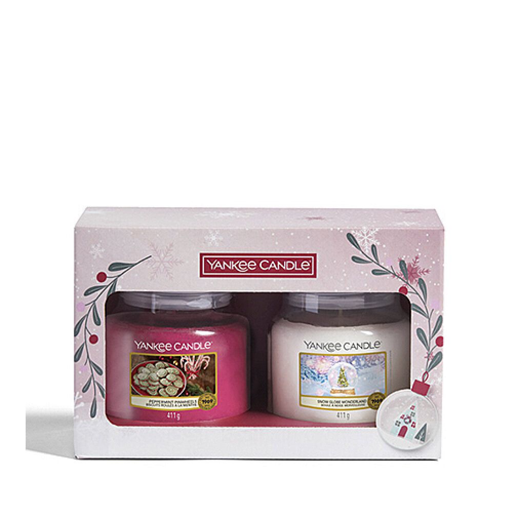 Confezione regalo con due candele Yankee Candle. Candele rosa e crema in vasi.