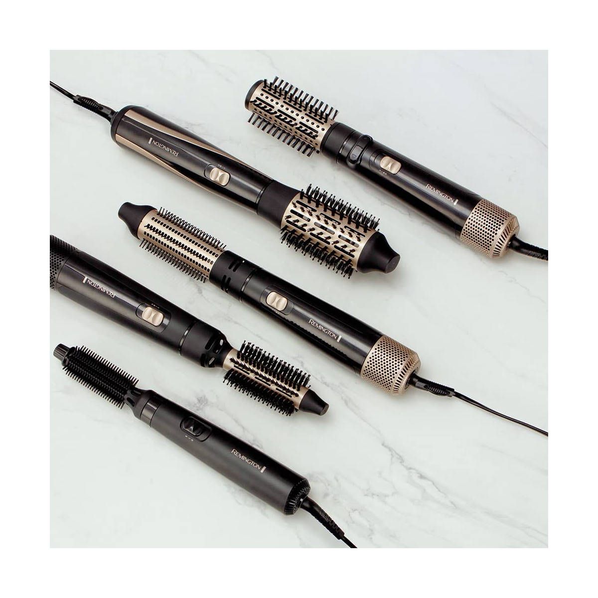 Diversi styler ad aria calda. Neri e dorati. Con vari accessori. Marchio: Remington.