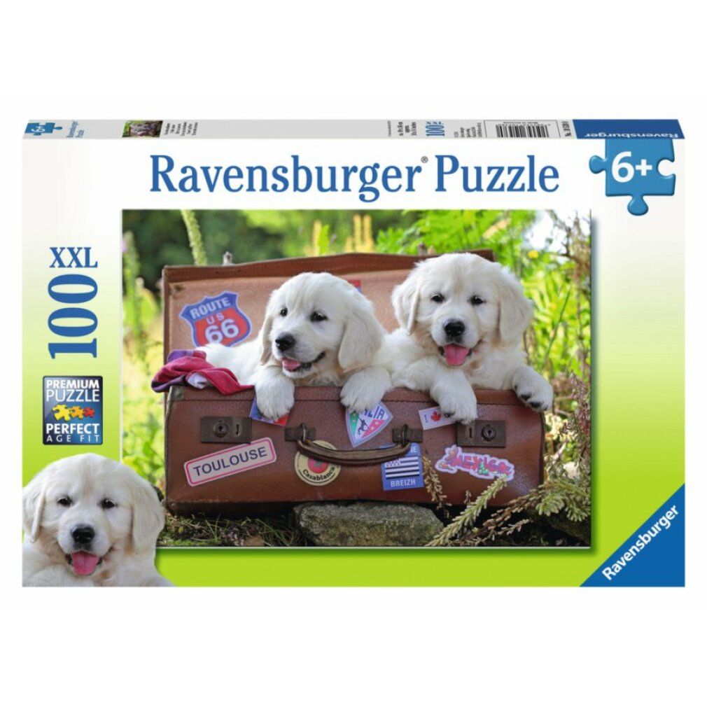 Scatola di puzzle con due cuccioli in una valigia. Scritta: Ravensburger Puzzle, 100 XXL, 6+.