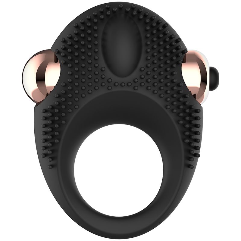 Anello vibrante per pene in silicone nero. Anulare con borchie e due elementi oro rosa. Pulsante nero.
