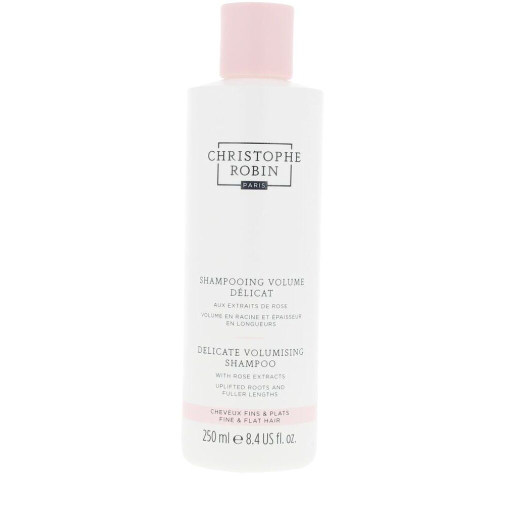 Flacone di shampoo bianco con tappo rosa. Testo: Christophe Robin, Shampooing Délicat Volume, Delicate Volumising Shampoo. Per capelli fini e piatti. 250 ml.