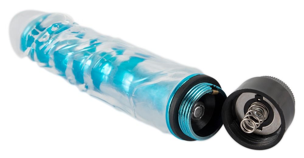 Vibratore con vano batteria rimosso. Il vibratore è trasparente con anima blu. Base nera, guarnizioni blu, molla visibile.