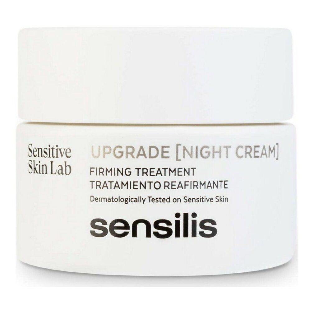 Vasetto bianco con coperchio. Scritta: Upgrade [Night Cream], Firming Treatment, Dermatologicamente testato. Marchio: Sensilis.