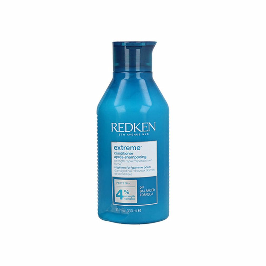 Flacone blu di Redken Extreme Conditioner. Contiene 300 ml. Scritta: Extreme, pH Balanced Formula, 4% Strength Complex.