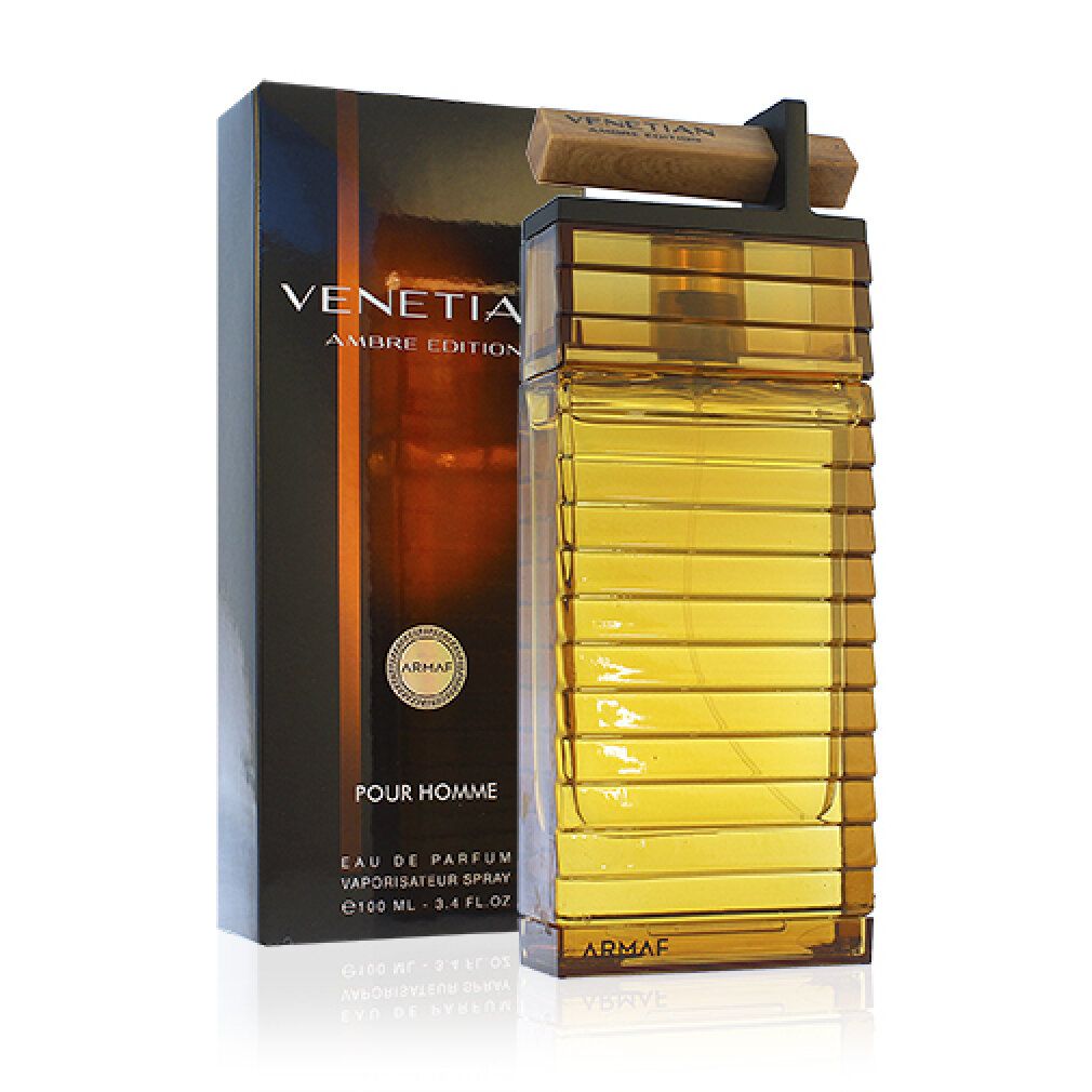 Flacone di profumo e confezione. Flacone rettangolare ambrato con tappo in legno. Confezione nera con testo dorato: Venetian Ambre Edition.
