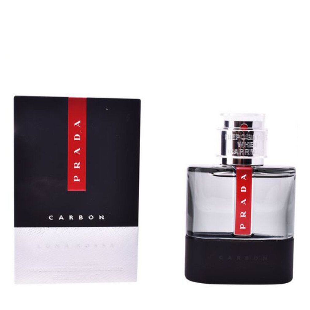 Scatola nera con striscia rossa e scritta PRADA. Flacone con striscia rossa e scritta CARBON.