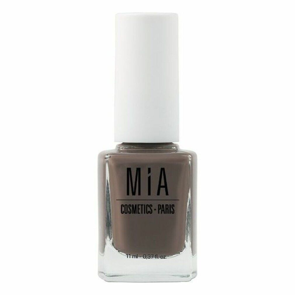 Flacone di smalto marrone con tappo bianco. Scritta: Mía Cosmetics Paris. Volume: 11 ml.