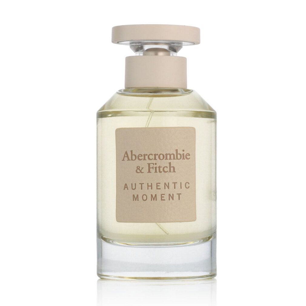 Flacone di profumo. Scritta: Abercrombie & Fitch, Authentic Moment. Liquido trasparente.