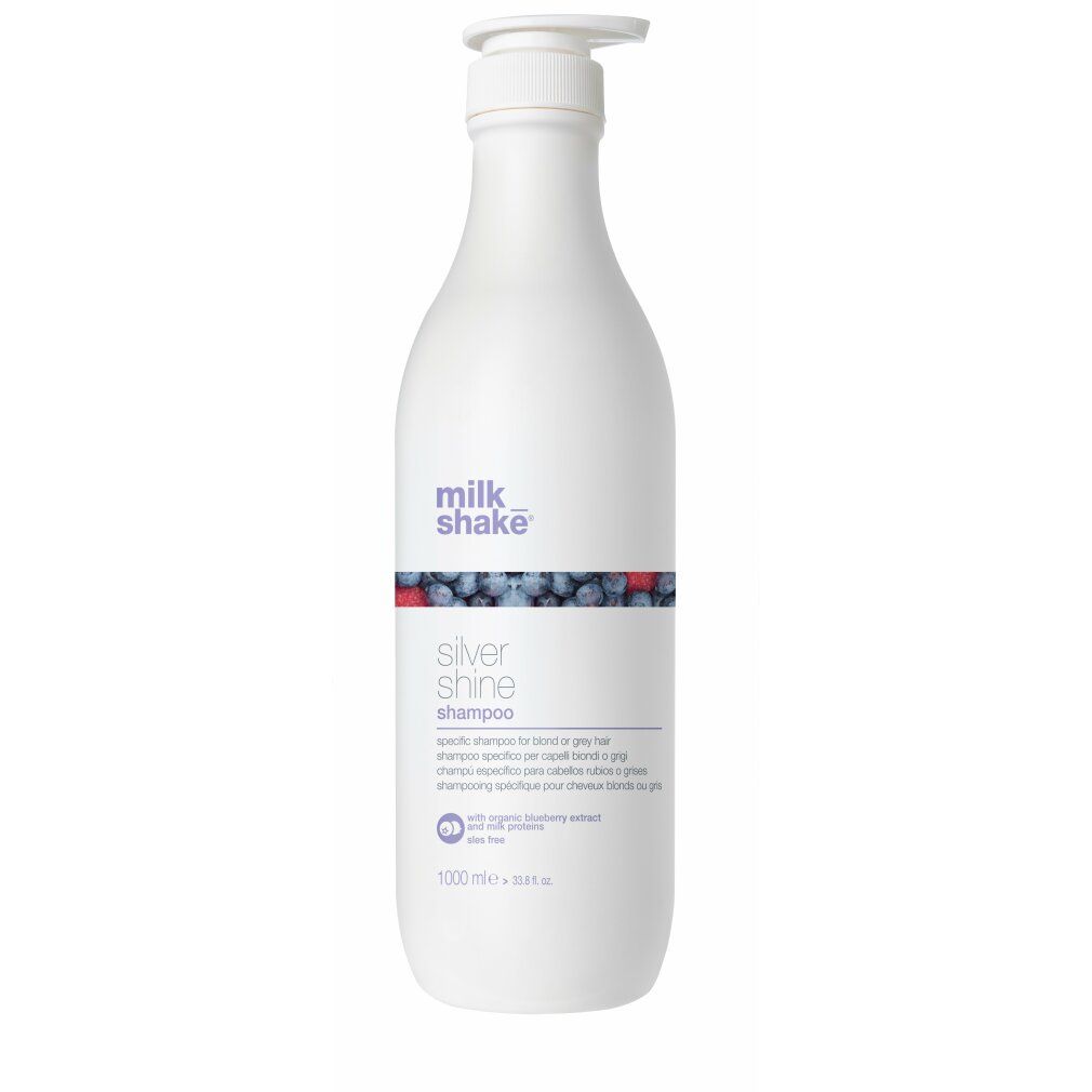 Flacone bianco con dosatore. Scritta: milk_shake Silver Shine Shampoo. Decorazione blu e rossa. 1000 ml.