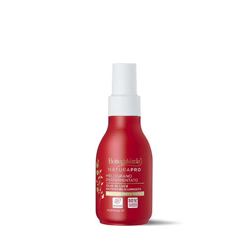 Flacone rosso con vaporizzatore bianco. Scritta: Natura Pro, Melograno Iperfermentato, Olio di Luce. Logo vegano.