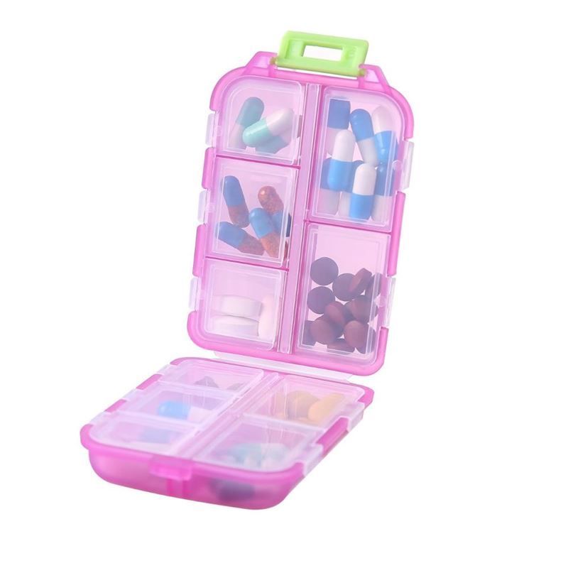 Piccola pillola trasparente a 8 scomparti, custodia rosa.