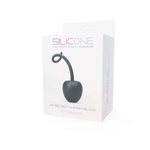 Confezione con un prodotto nero a forma di ciliegia. Sulla confezione è scritto "SILICONE" e "MY SECRET CHERRY BLACK".