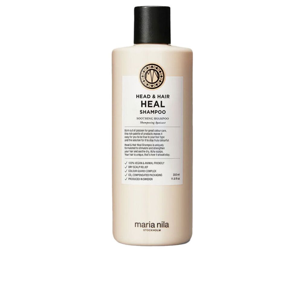 Maria Nila Head & Hair Heal Shampoo. Flacone beige con tappo nero. Etichetta con informazioni e logo. Vegano e cruelty-free.