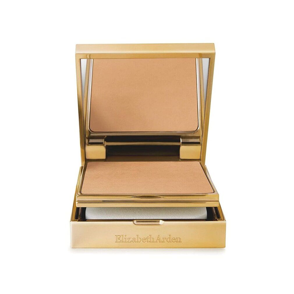 Cofanetto compatto dorato con specchio, spugna e trucco. Aperto.
