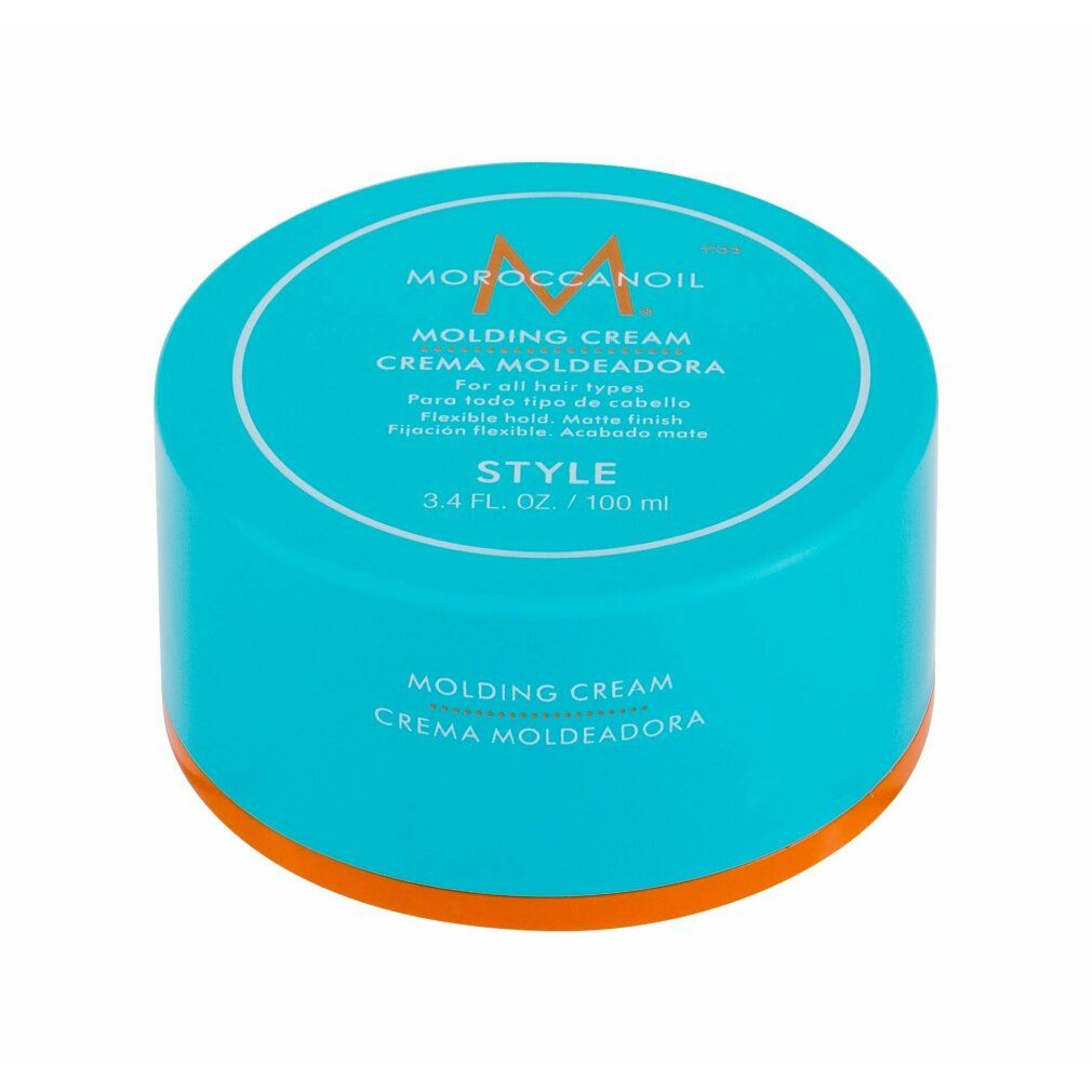 Barattolo turchese con coperchio bianco. Scritta: Moroccanoil Molding Cream. Bordo arancione. Testo: Style, 3.4 fl. oz. / 100 ml.
