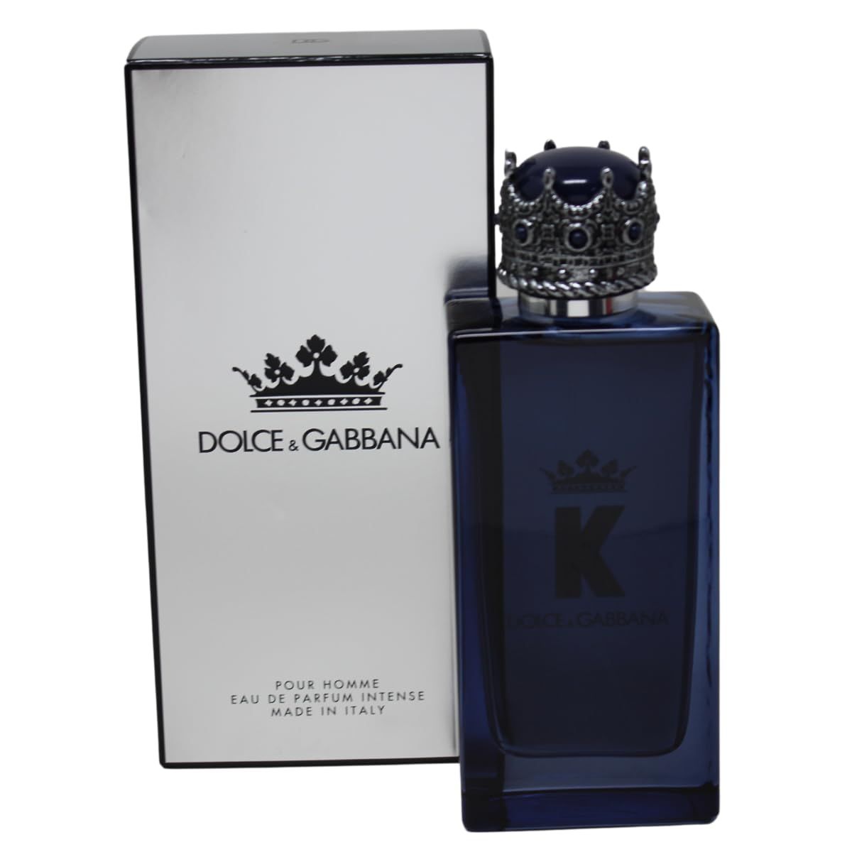 Flacone blu con tappo a corona accanto a confezione bianca. Logo 'K' e DOLCE & GABBANA. Confezione con logo e testo.