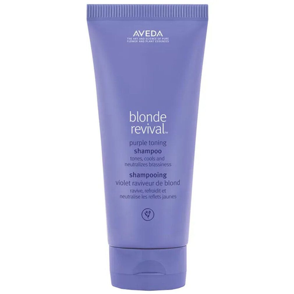 Tubo di shampoo Aveda Blonde Revival Purple. Tubo viola con testo bianco. Nome del prodotto e marchio visibili.