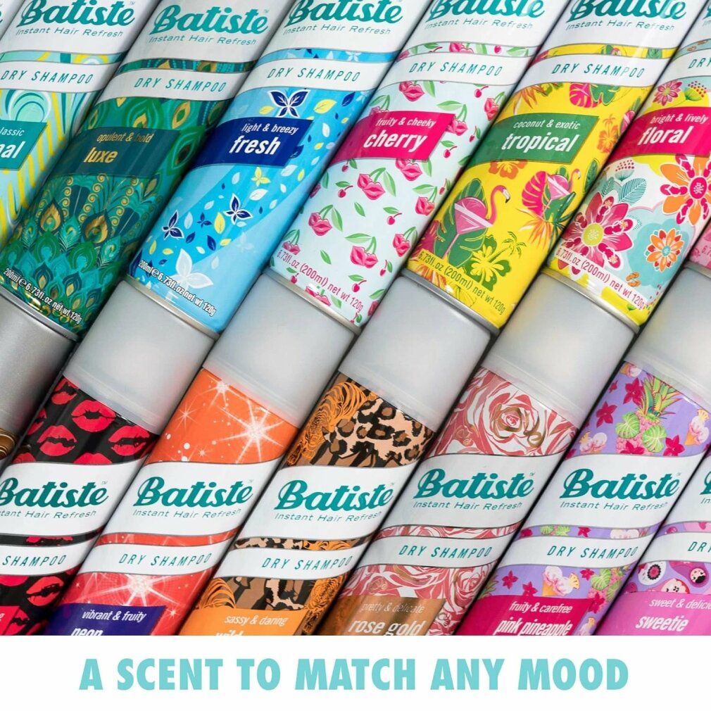 Fila di flaconi di shampoo secco Batiste con diversi design. Testo: A scent to match any mood.