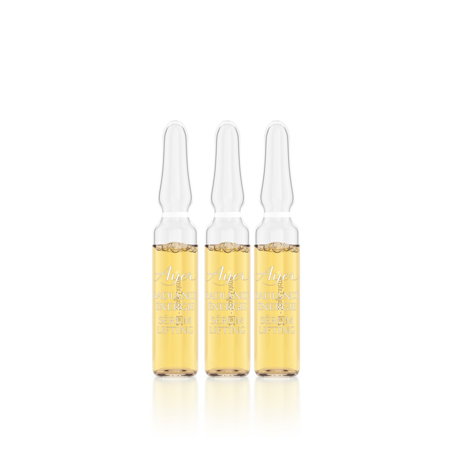 Tre fiale di vetro con liquido giallastro. Scritta Ayer Radiance Energy Lifting Serum.