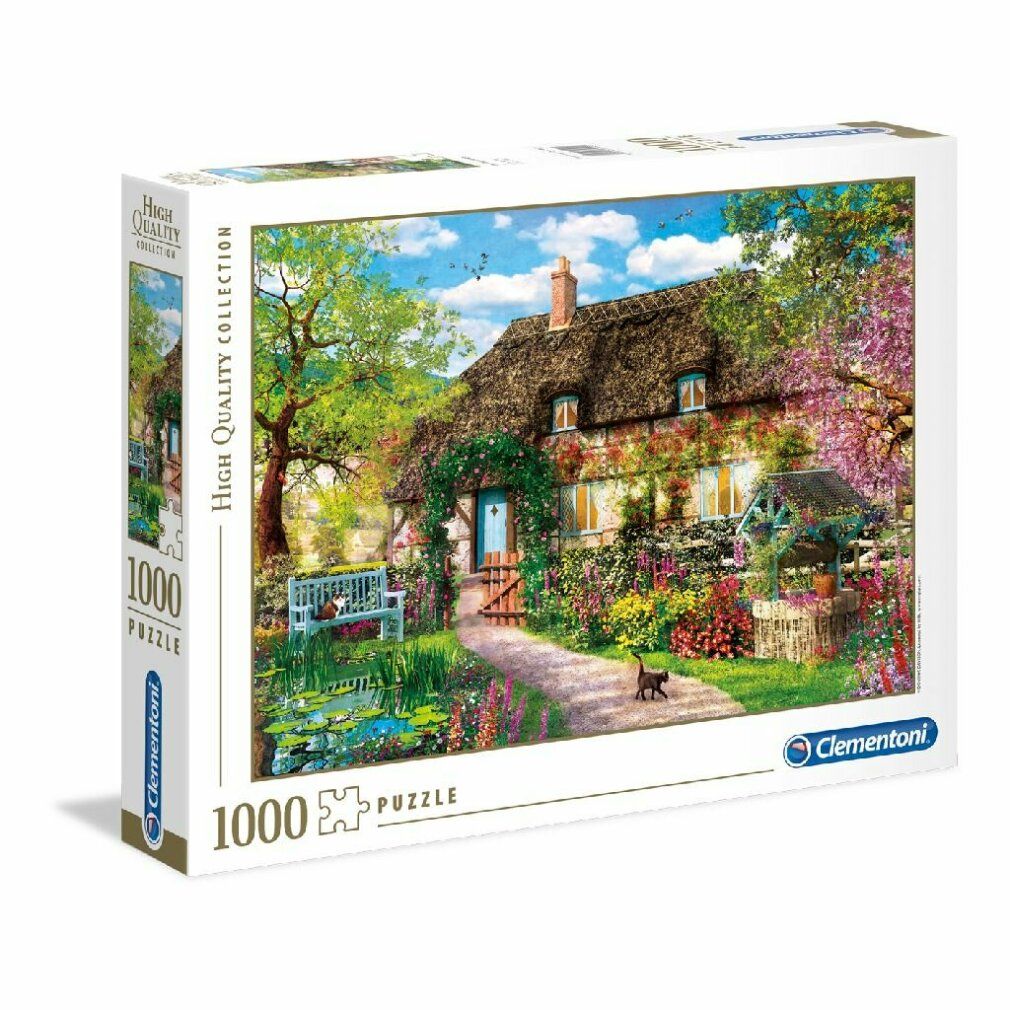 Puzzle Clementoni 1000 pezzi. Immagine del cottage con giardino. Pezzi senza cornice, che mostrano l'immagine.