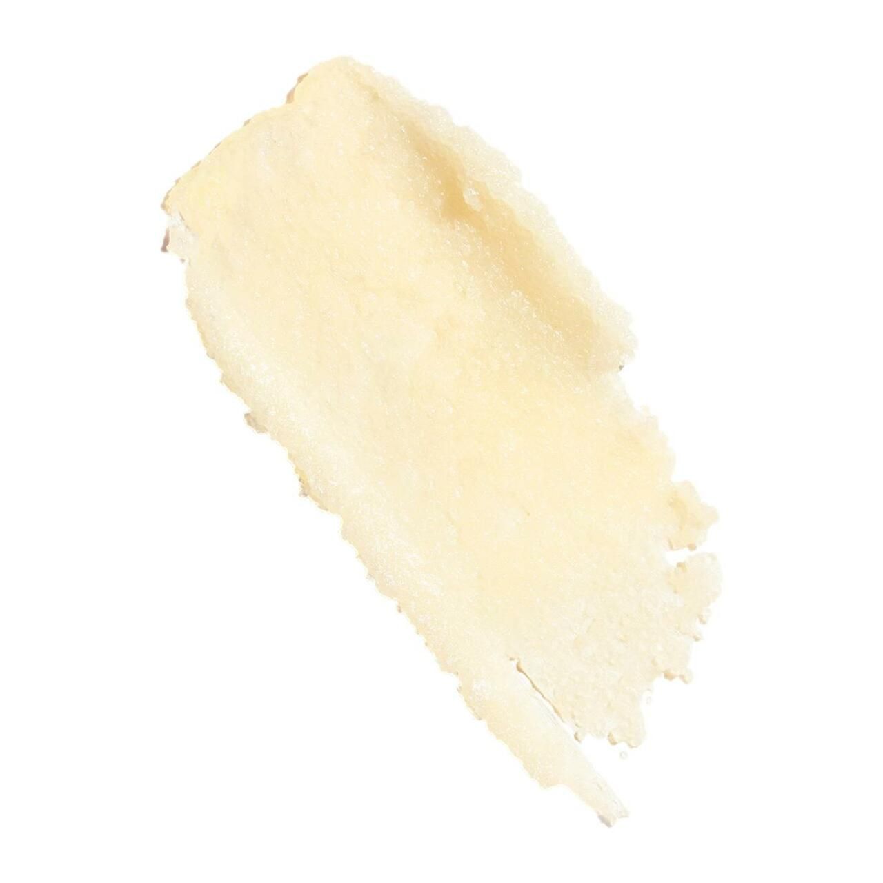 Strofinata del prodotto. Texture giallastra e granulosa. Su sfondo bianco.