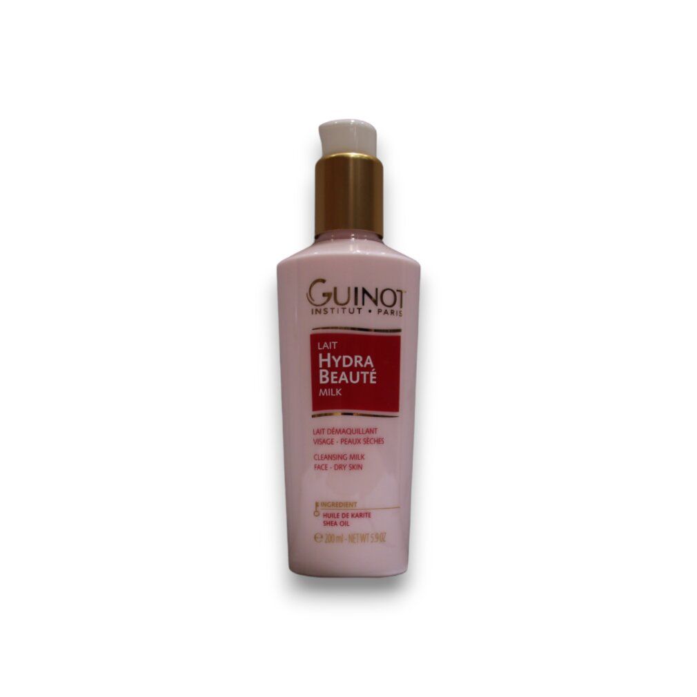 Flacone rosa con tappo dorato. Scritta: Guinot, Lait Hydra Beauté, Cleansing Milk. Per pelli secche.