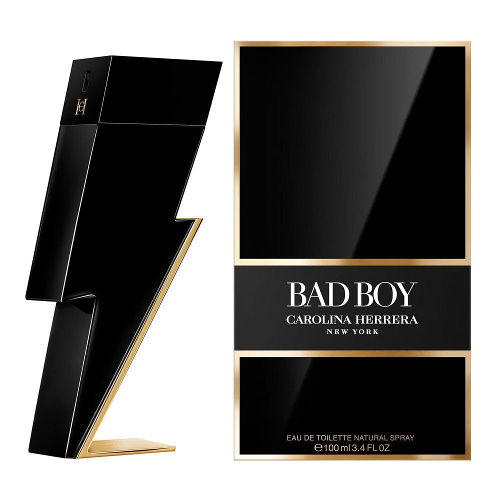 Flacone nero a forma di fulmine con dettagli dorati e confezione. Scritta: BAD BOY CAROLINA HERRERA NEW YORK.