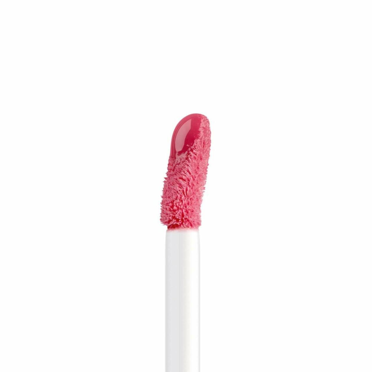 Primo piano dell'applicatore per Artdeco Plumping Lip Fluid. Punta rosa su stelo bianco.