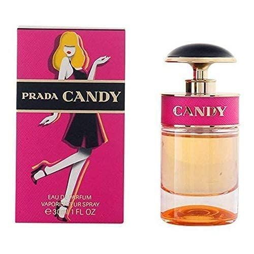 Flacone di profumo e confezione. Confezione rosa con donna. Flacone con fascia rosa e tappo nero. Scritta: Prada Candy.