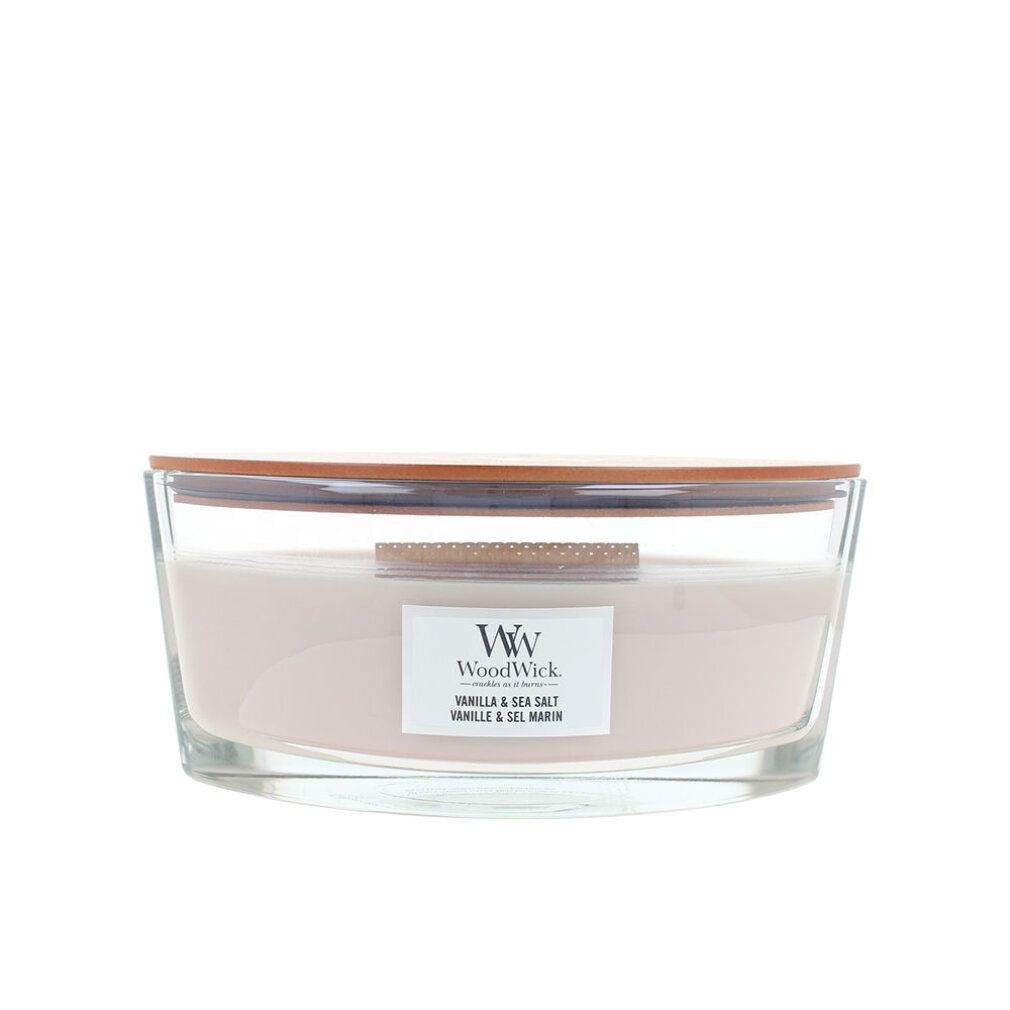 Candela Ellipse con coperchio. Contenitore in vetro, cera color crema. Etichetta 'Vanilla & Sea Salt'.