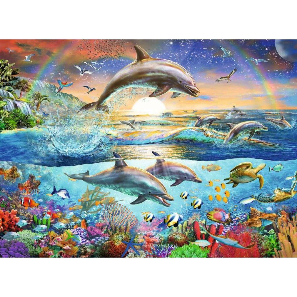 Puzzle con delfini, tartarughe marine e pesci sott'acqua e sulla spiaggia. Un arcobaleno attraversa il cielo.