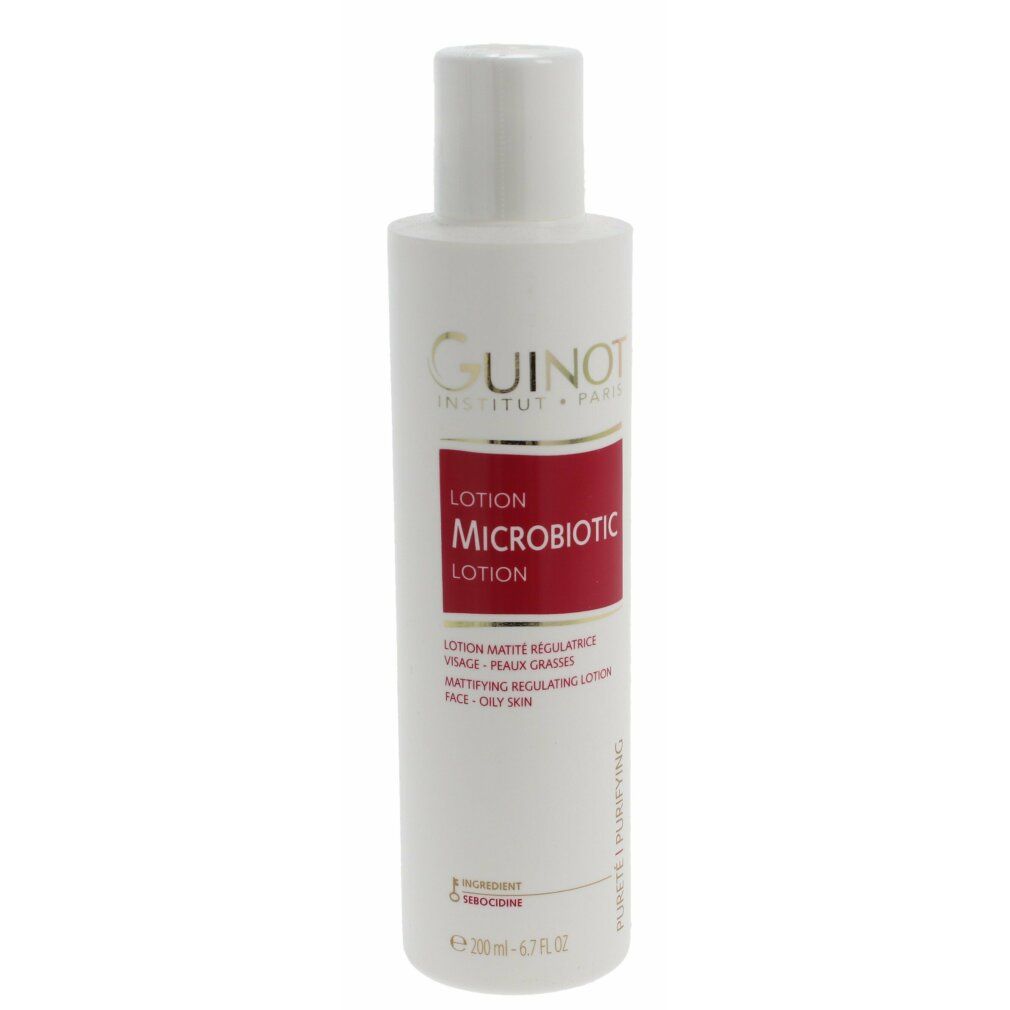 Flacone bianco con etichetta rossa. Logo Guinot e nome del prodotto Microbiotic Lotion. Testo: Lotion Matifiante Régulatrice.