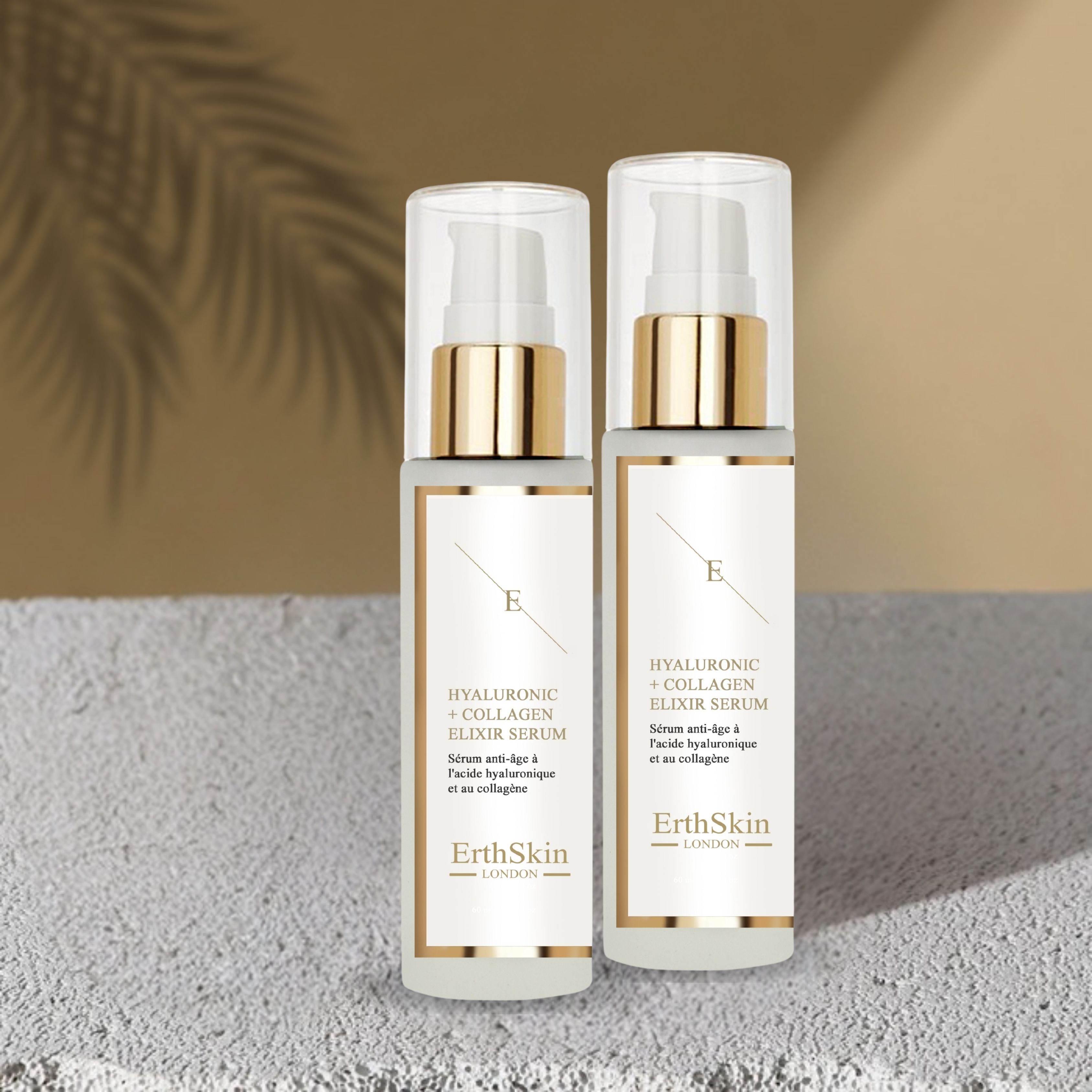 Due flaconi di siero con dosatore a pompa. Scritta: Hyaluronic + Collagen Elixir Serum. Marchio: ErthSkin London. Sfondo: ombra.