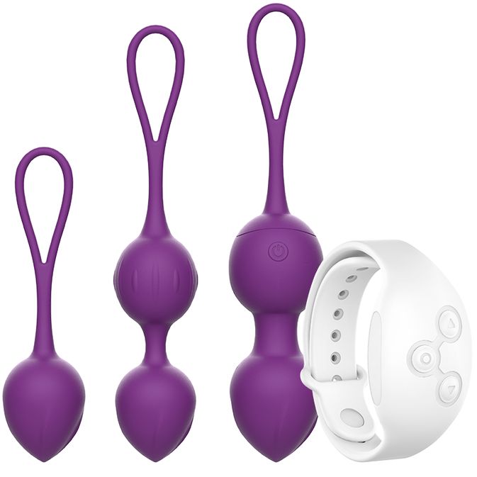 Tre sfere vibranti viola con anelli e un telecomando bianco. Una sfera ha un interruttore.