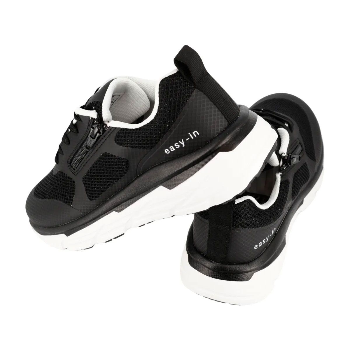 Sneakers neri con suola bianca. Cerniera. Testo: easy-in. Marchio HERGOS. Inserti in mesh.