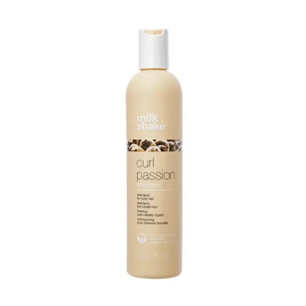 Flacone di shampoo beige con tappo bianco. Scritta: milk_shake, curl passion shampoo. Per capelli ricci.