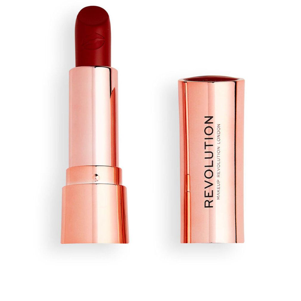Rossetto rosso, aperto. Astuccio in metallo dorato. Scritta "REVOLUTION MAKEUP LONDON" sull'astuccio.