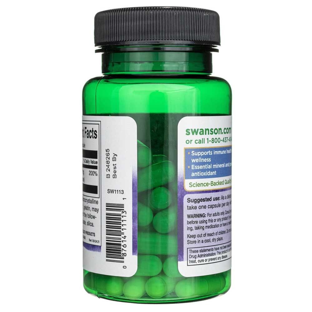 Flacone verde in plastica con tappo nero, riempito di capsule verdi. Etichette con informazioni nutrizionali e sul prodotto.