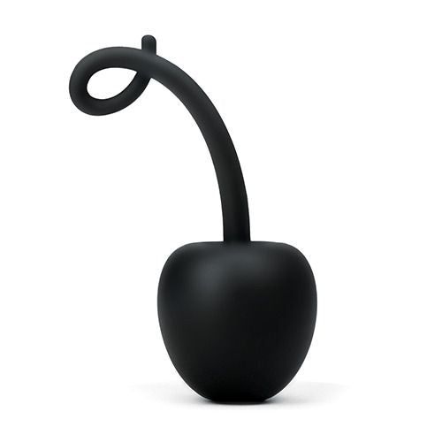 Prodotto nero a forma di ciliegia con stelo curvo. Il prodotto è posto su una superficie bianca. È realizzato in materiale morbido.