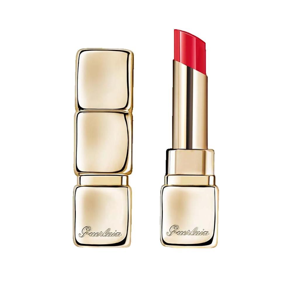Rossetto in astuccio dorato, aperto. Stick di rossetto rosso visibile. Marchio Guerlain.