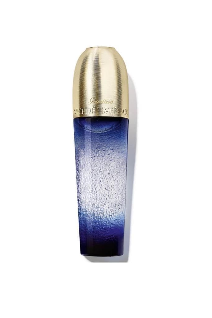 Flacone blu trasparente, tappo dorato. Scritta: Guerlain Orchidée Impériale. Vista verticale.