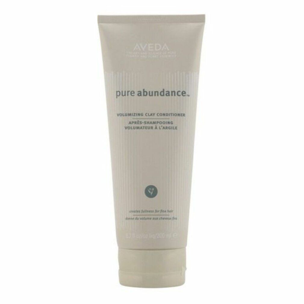 Tubo beige con testo e nome del prodotto. Marchio Aveda. Volumizing Clay Conditioner.